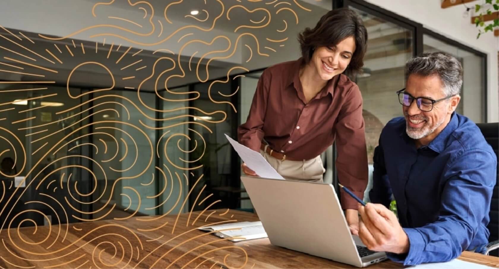A man and a woman happily review paper work while also looking at a laptop.